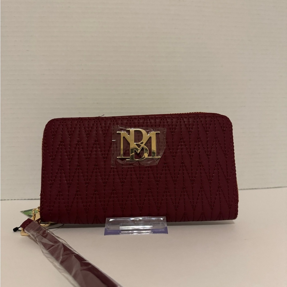 NWT. Long wristlet wallet with phone holder.12 card slots money and coin slot